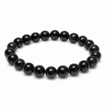 Dark 8mm Astrophyllite beaded stretch bracelet with subtle natural markings on white background