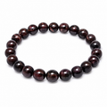 8mm garnet bracelet, deep burgundy polished round gemstone beads on white background