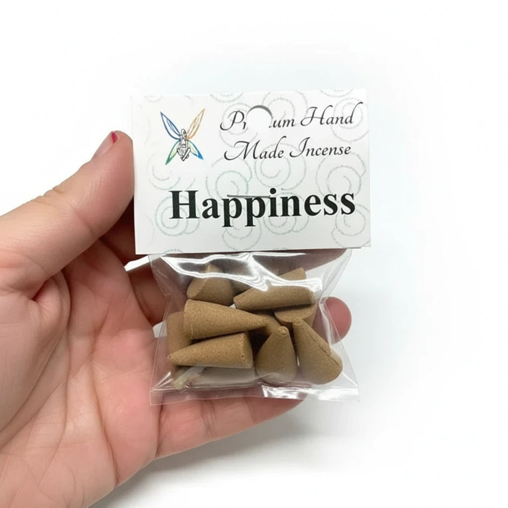 Crystal Fairy Patch Happiness premium hand-made incense cones in a small clear plastic bag held in a hand