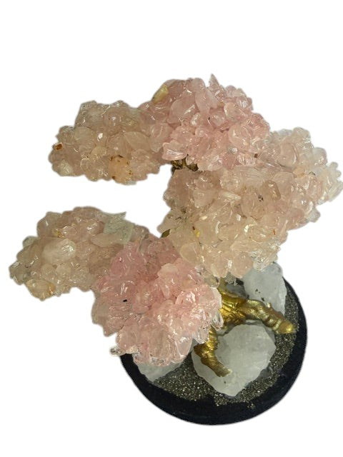 Crystal Fairy Patch rose quartz bonsai tree with gold trunk on a raw quartz and pyrite base for home decor and crystal healing.