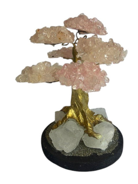 Crystal Fairy Patch rose quartz bonsai tree with gold-tone trunk on a raw quartz and pyrite-coated base for home decor.