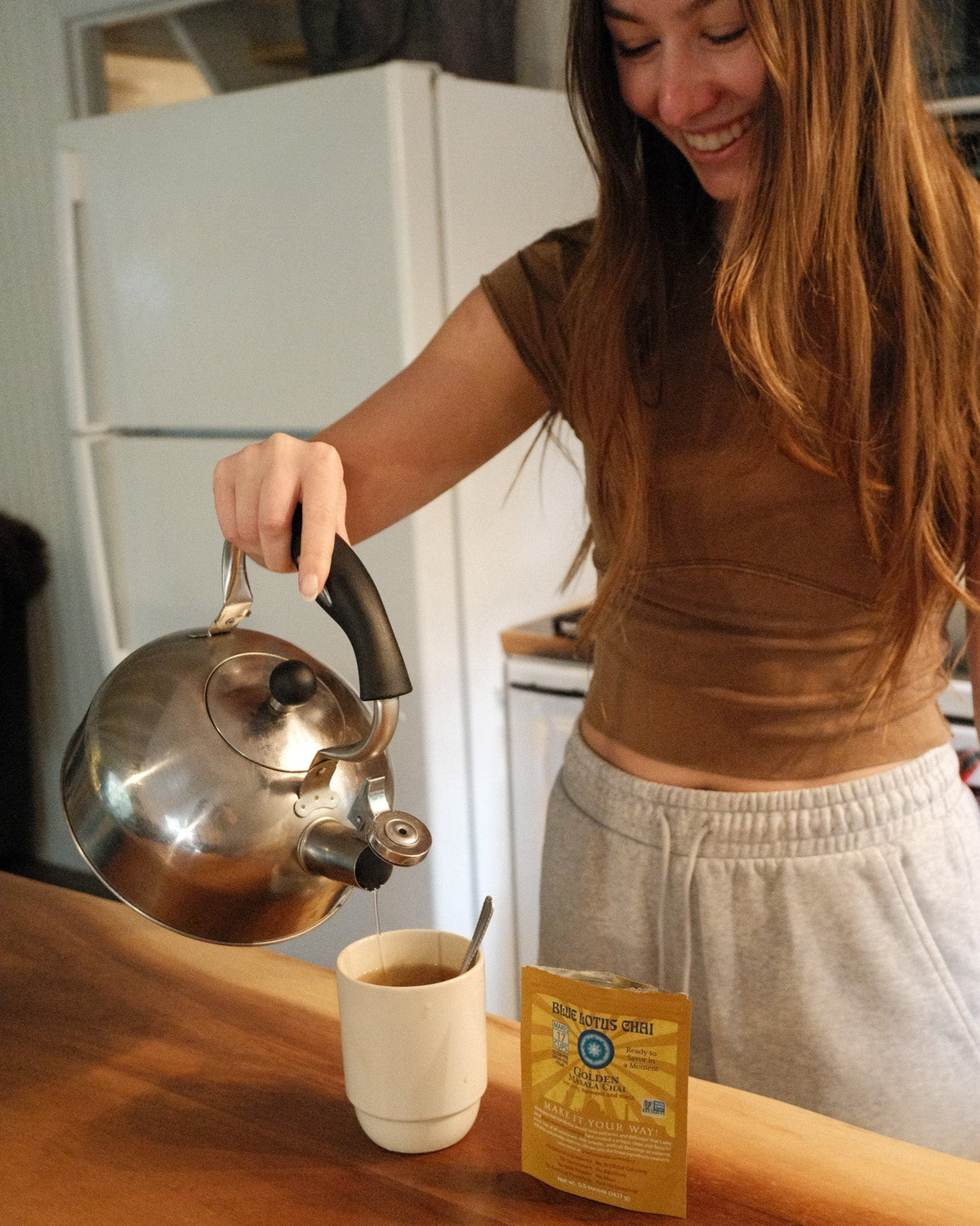 Making Blue Lotus Golden Masala Chai in the kitchen