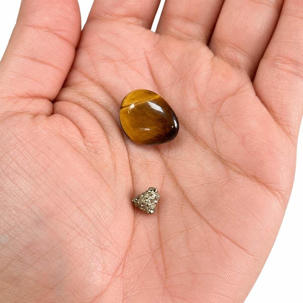 Tiger's Eye and tiny Pyrite in an open palm for size