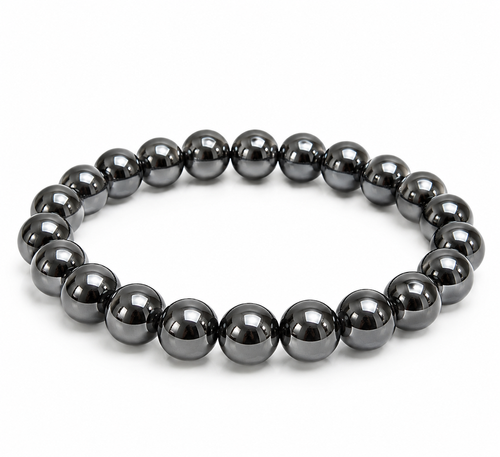 Magnetic hematite 8mm stretch bracelet with reflective gunmetal beads on a white background