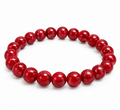 Red 8mm Mountain Jade beaded bracelet on white background
