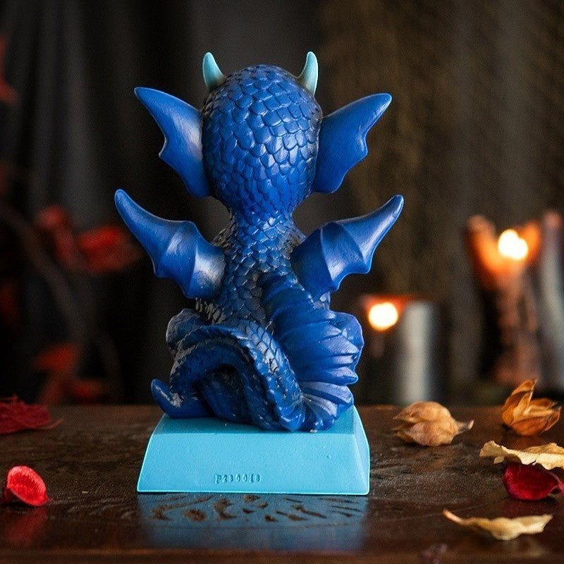 My Store blue dragon figurine with textured scales, small horns, and wings, perched on a light blue base.