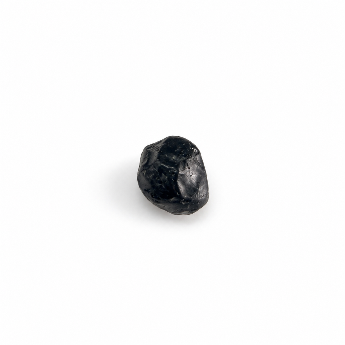 Close-up of Apache Tear featured stone