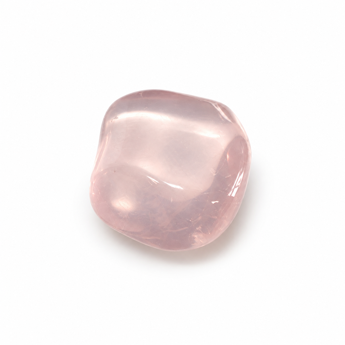 Polished pale pink translucent Rose Quartz on white